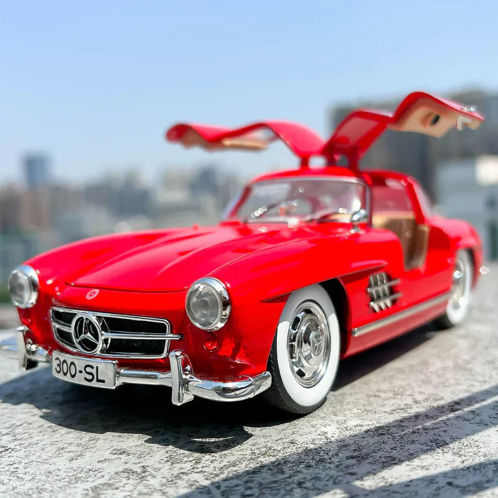 Red toy car with open doors on a blurred cityscape background