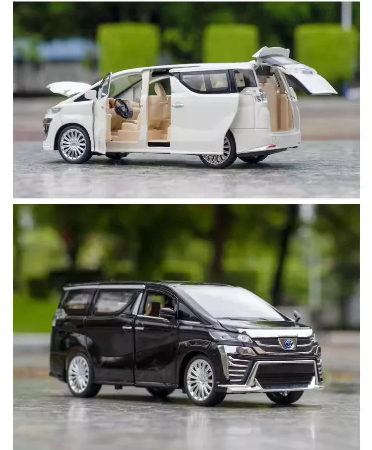 Two toy models of vans, one white and one black, on a road with blurred greenery in the background.