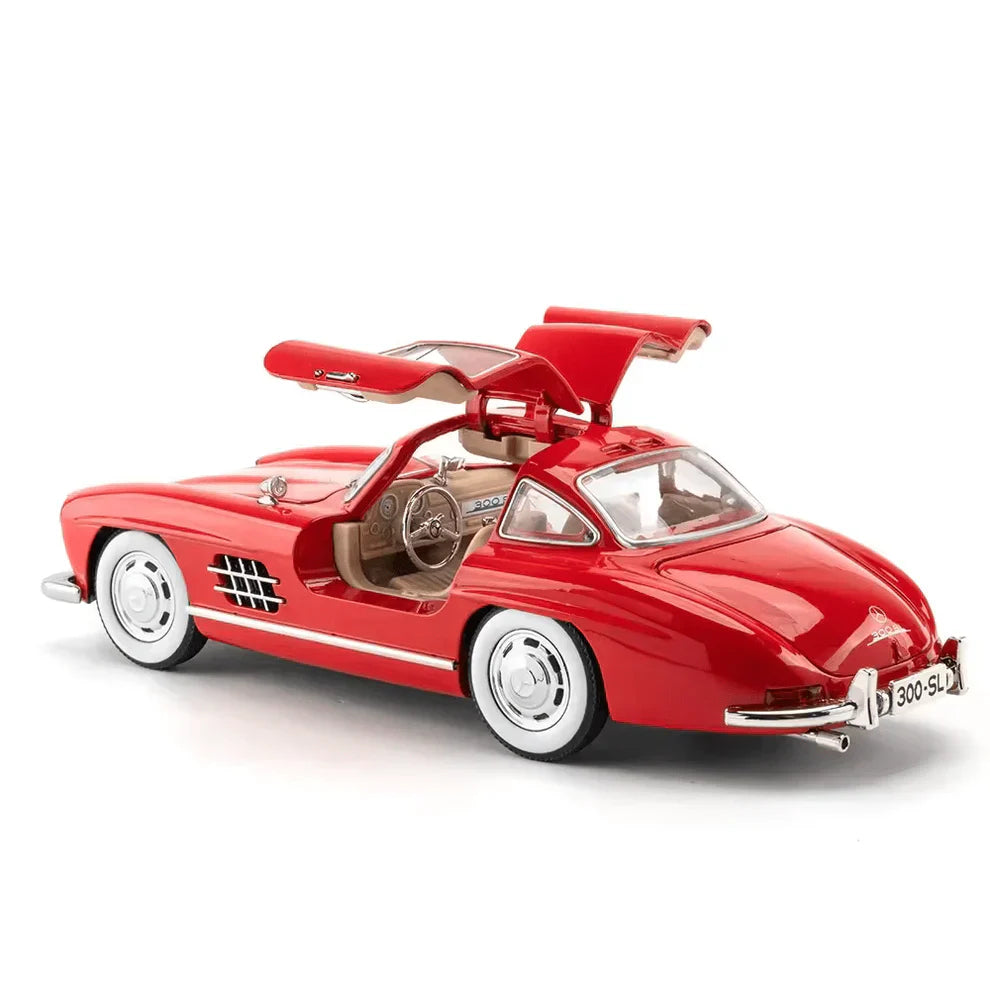 Red model car with open doors on a white background